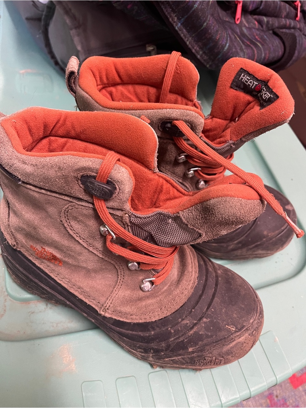 The North Face Kids Heat + Dry Insulated Boots in brown and orange